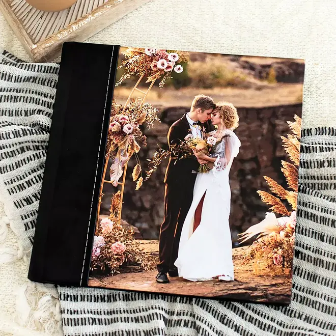 RapidStudio ultimate coffee table photobook album with black leather semi-personalised printed cover and white stitching