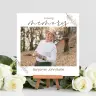 "Square contemporary memory photo print featuring a smiling elderly man in a white shirt and hat, set against an autumnal background. The print includes the text 'in loving memory' and a name, with delicate floral accents. Displayed on a small wooden easel, surrounded by white roses."