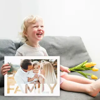 Happy customer holding a stunning canvas print, showcasing the affordable and premium-quality canvas printing specials available at RapidStudio.