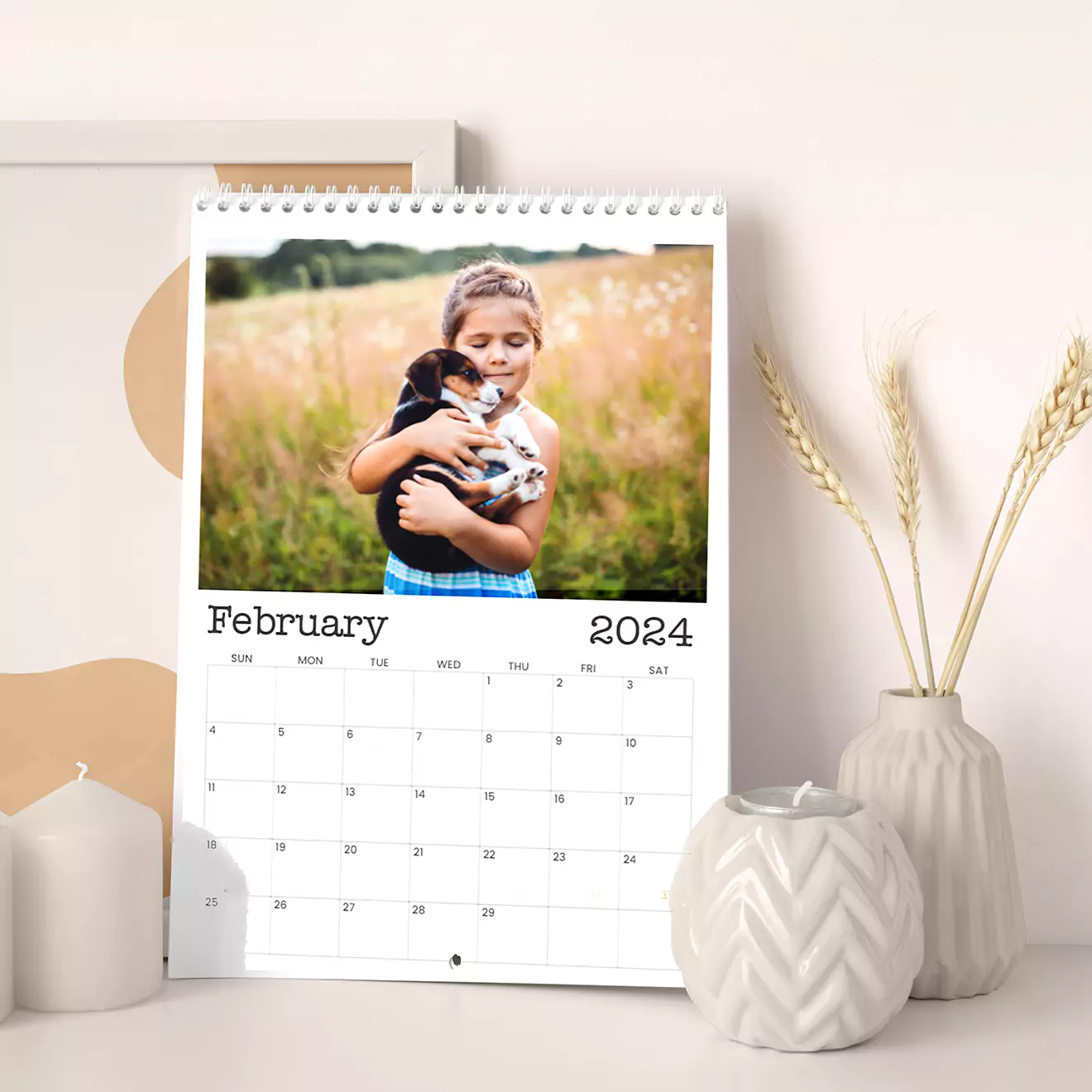 Wall calendar showcasing multiple South African languages, featuring a playful image of a baby near a pool for each month, celebrating South Africa’s cultural and linguistic diversity in a charming way.