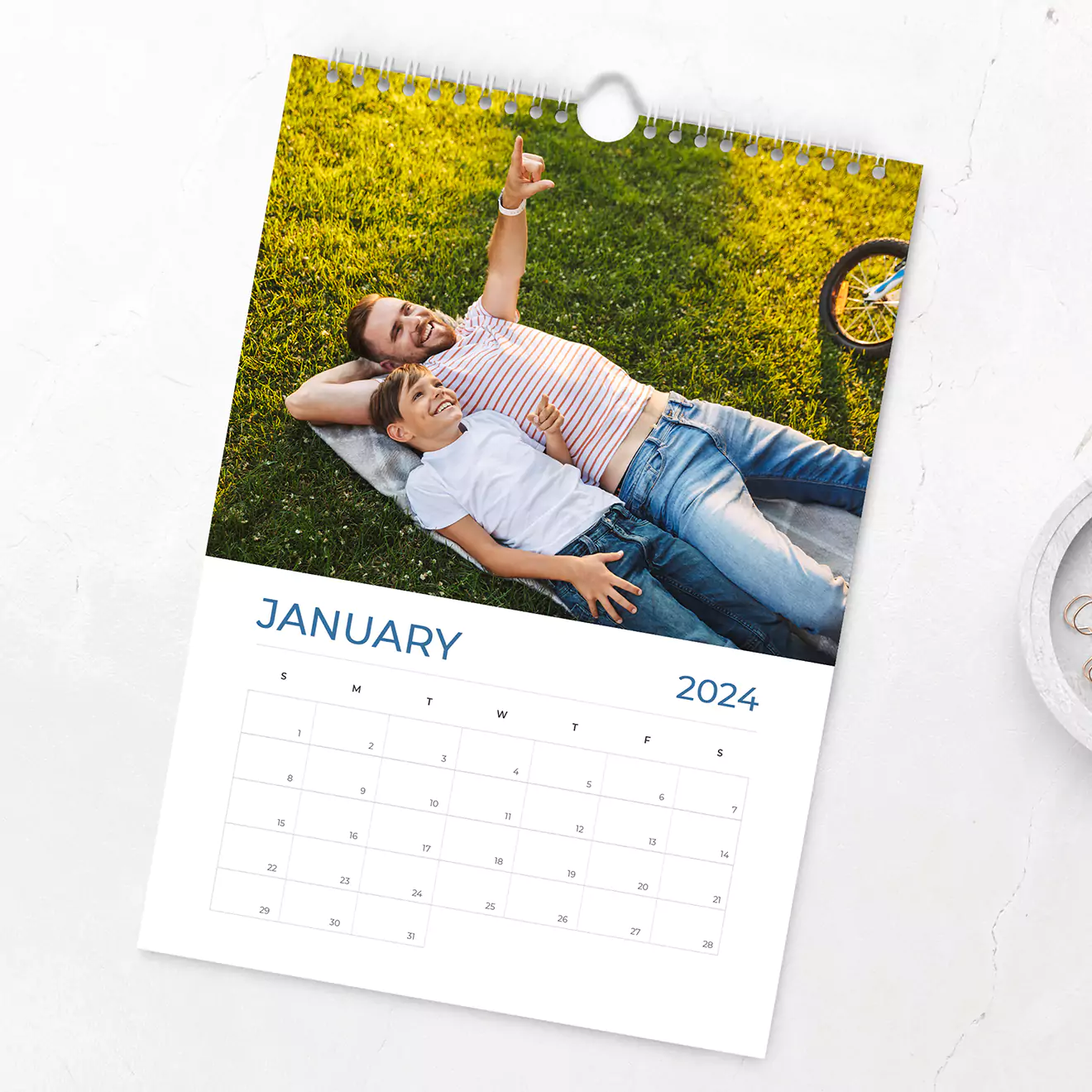 Holiday wall calendar with a stylish design featuring white text on a black background, each month showcasing popular holiday destinations, perfect for planning and dreaming about your next vacation.