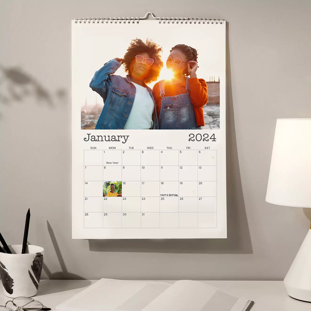 Personalised calendar displayed on a table alongside a coffee cup, featuring a heartwarming photo of a mom and daughter, blending perfectly into daily life and keeping cherished memories close.