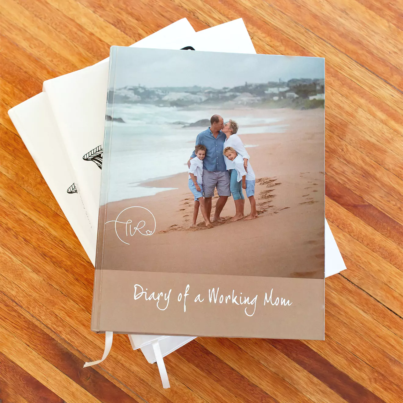 Personalised diary on a desk showcasing a family portrait on the cover, blending practical daily planning with cherished family memories.