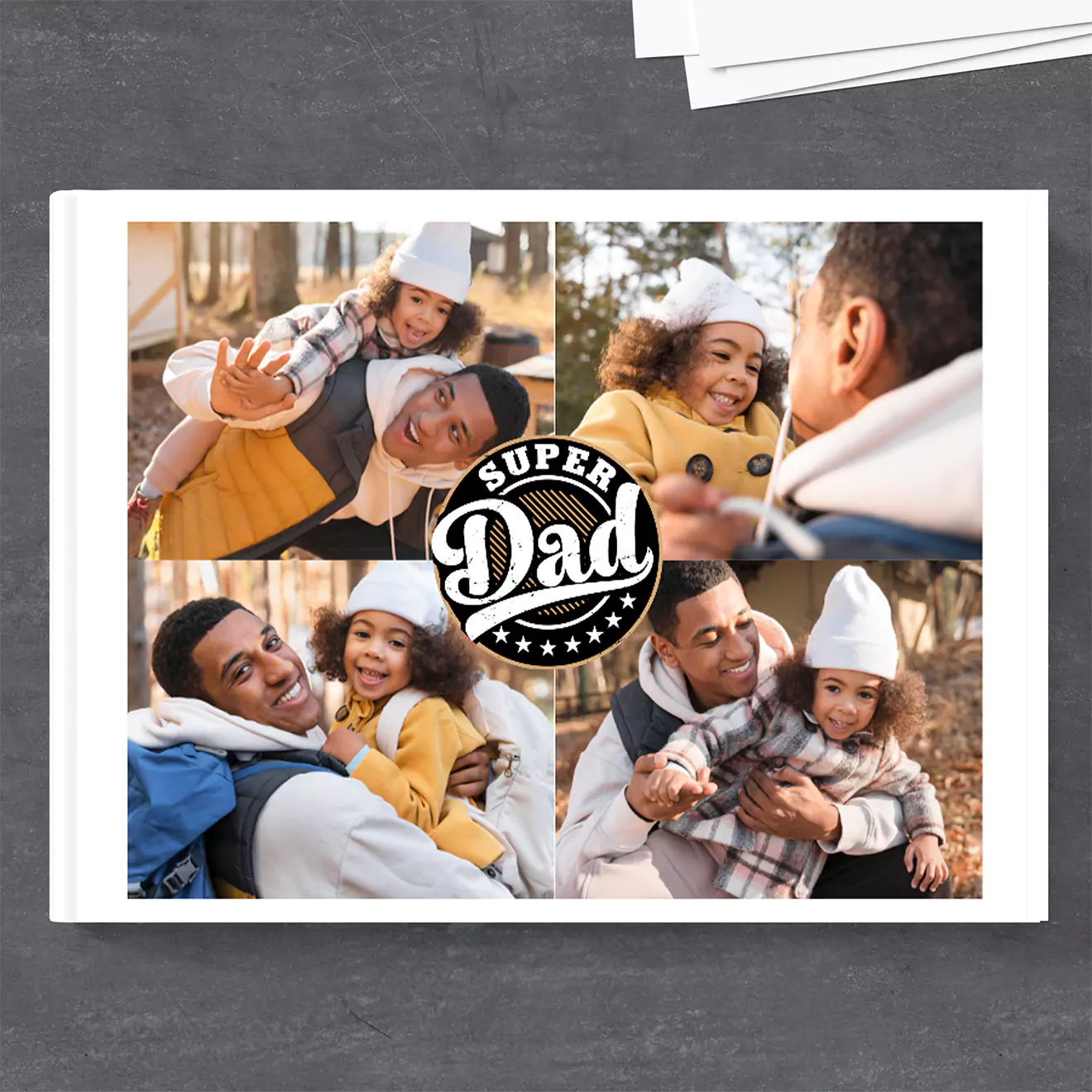 Father's Day photobook cover featuring a collage of joyful moments between a father and his child, with the text 'Super Dad' in the center. The cover showcases outdoor scenes and playful interactions.