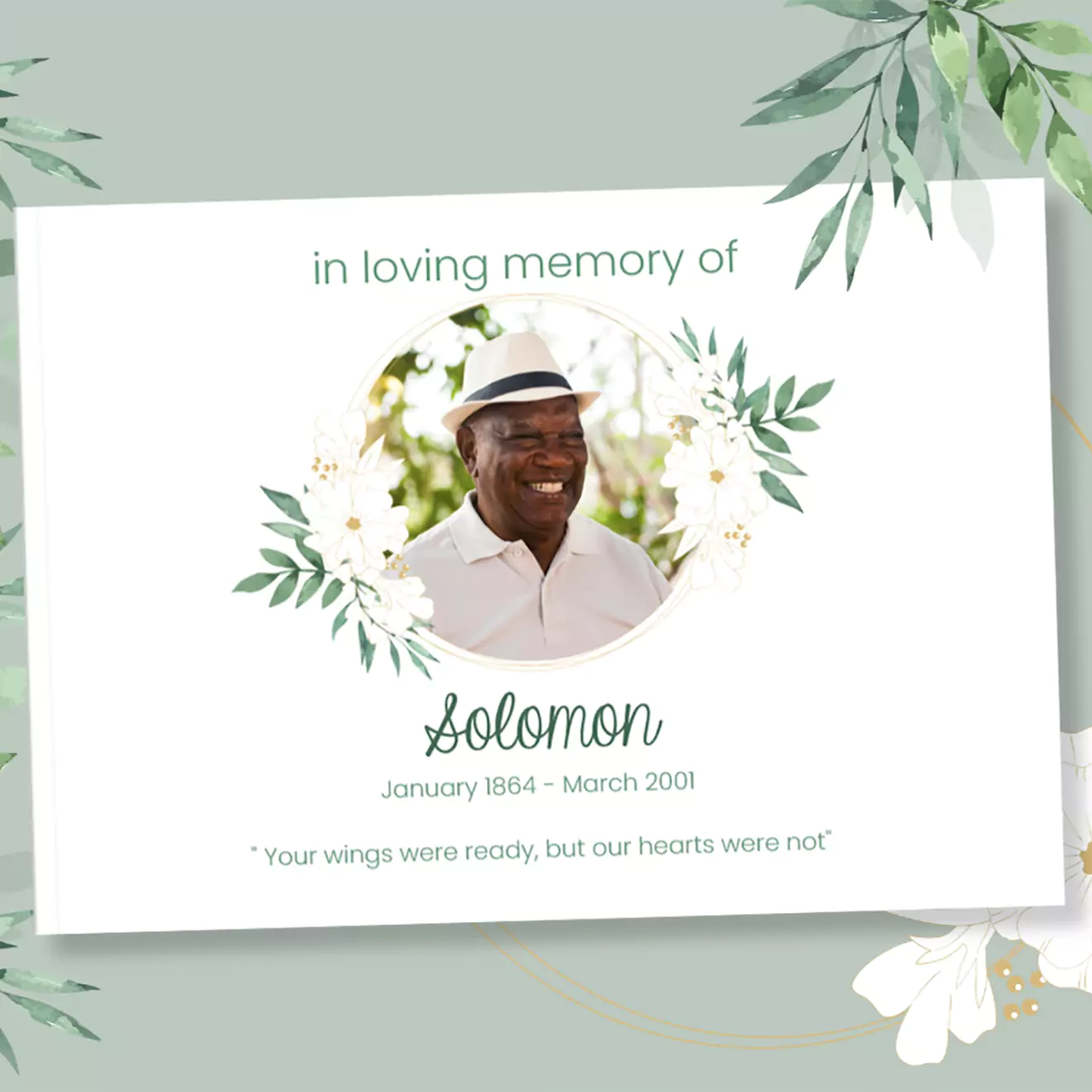 Funeral memory card featuring a smiling man in a white hat and shirt, surrounded by green foliage. Text reads 'In loving memory of Solomon, January 1964 - March 2001. Your wings were ready, but our hearts were not.'