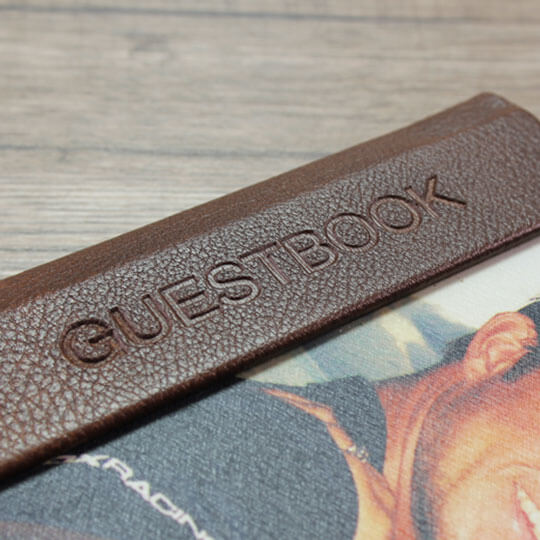 Embossed detailing on the cover of RapidStudio’s personalised guestbook, adding a touch of sophistication and personalisation.