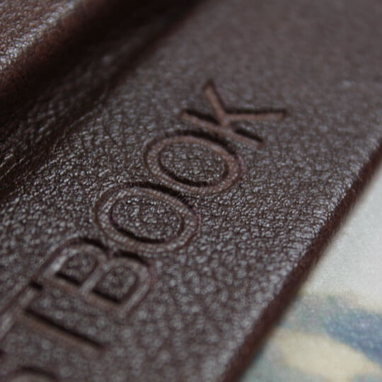 Zoomed-in view of the embossing on the cover of RapidStudio’s personalised guestbook, showcasing intricate details and texture.