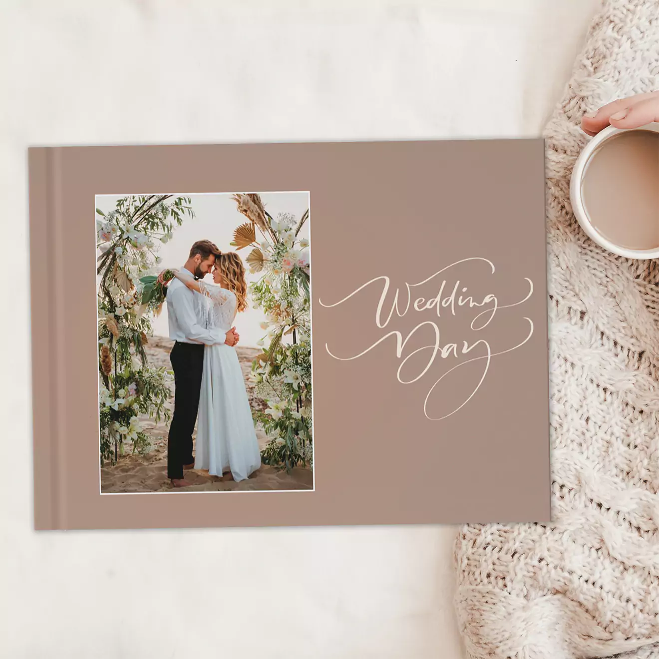 Wedding day photobook cover displaying a couple embracing, capturing a poignant moment. Perfect for preserving special wedding memories.