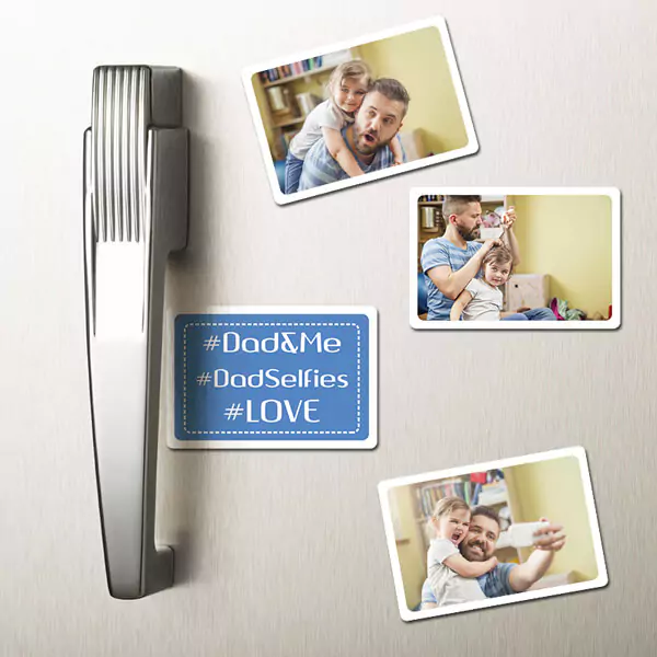 Set of four personalised fridge magnets displayed on a fridge door, each showcasing a heartwarming photo of a dad with his little child, perfect for keeping cherished family moments in view every day.