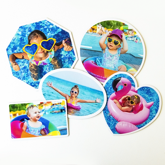 Assortment of personalised fridge magnets in various shapes, all adorned with vibrant photos of children playing in a pool, adding a splash of fun and colour to your kitchen decor.