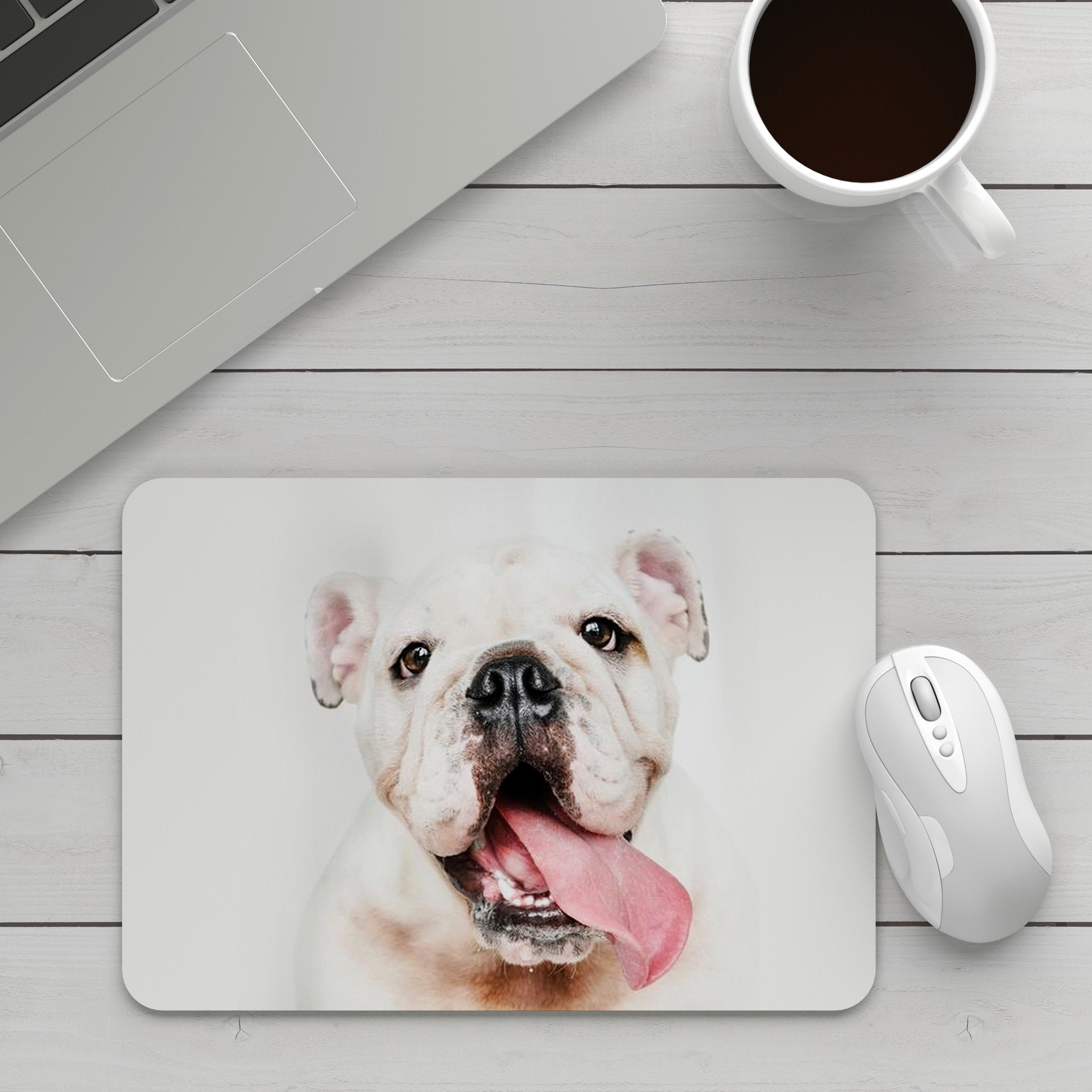 Rectangular mouse pad on a table, adorned with a picture of a dog, accompanied by a mouse and a cup of coffee, creating a cozy and personalised workspace setting.