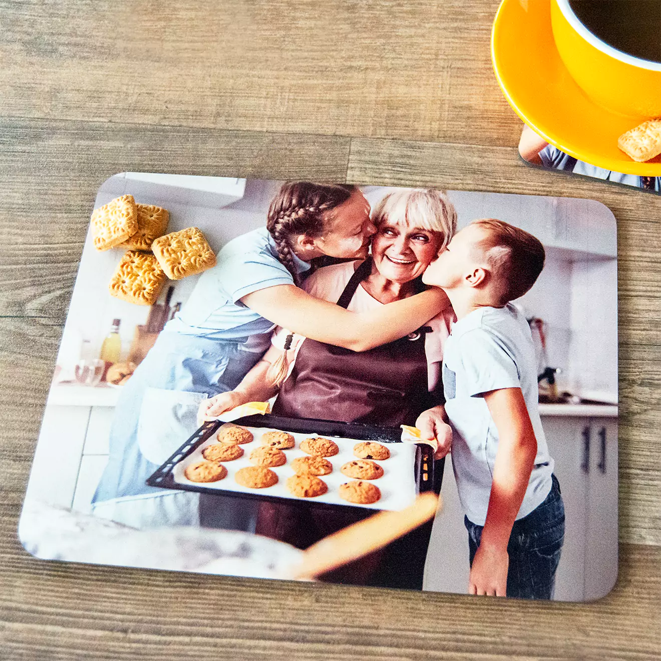 Personalised placemat featuring a heartwarming photo of a mom with a baking tray, receiving kisses from her two children, perfect for adding a touch of love and warmth to family meal times.