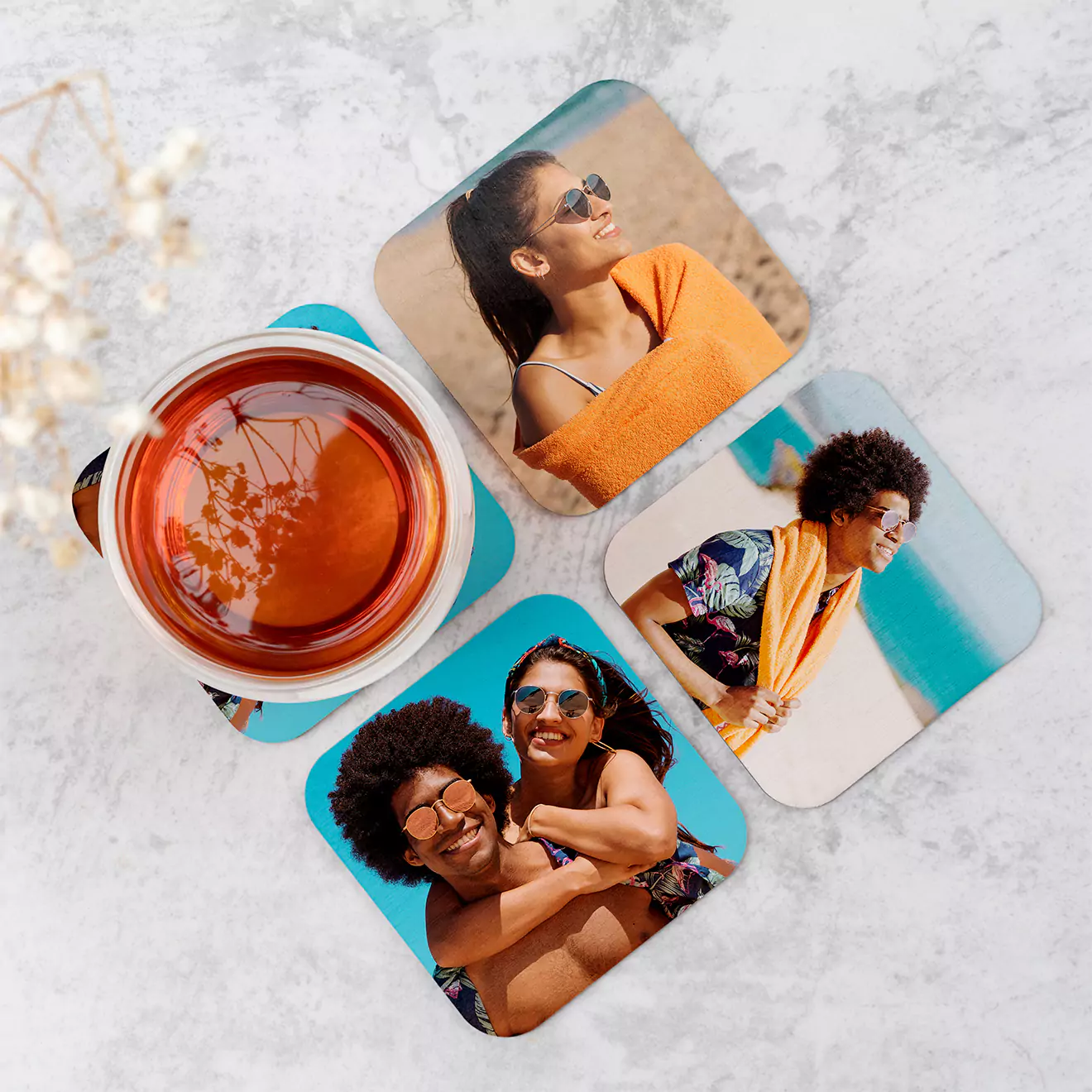 Set of four personalised coasters, each adorned with a favourite photo of a child, perfect for adding a personal touch to your home decor and protecting surfaces in style.