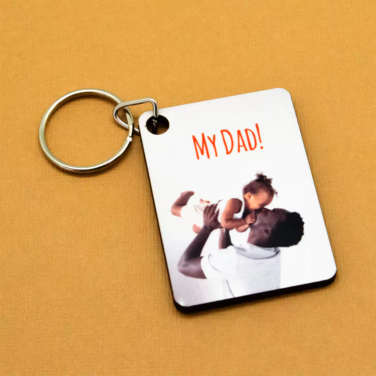 Large Rectangular personalised keyring featuring a photo of a father holding a child with the text "My Dad!" on a white background. Ideal for gifts for dad, Father's Day, or birthday presents.