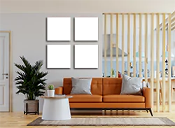 Four-piece canvas set displayed in a modern living room with a brown sofa and white coffee table. The canvases feature abstract designs in neutral tones, adding a stylish touch to the decor. Ideal for personalised gifts, photo to canvas projects, and home decoration.