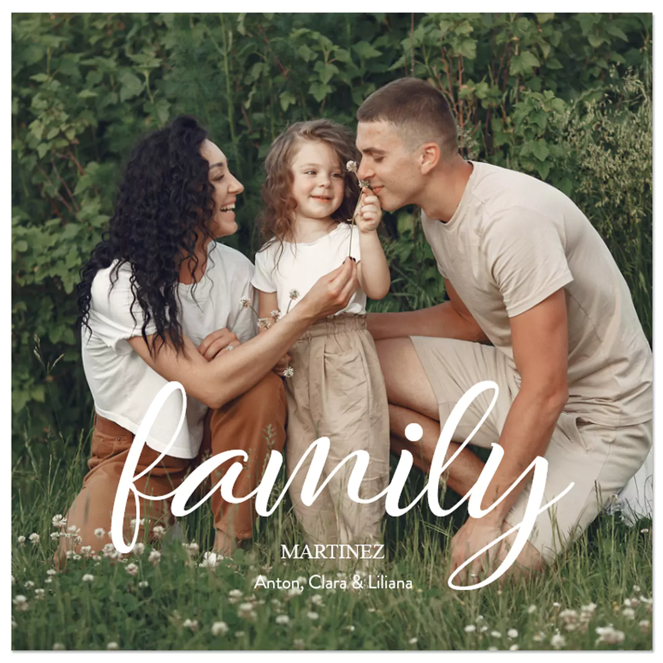 Personalised family photo book cover featuring a happy family of three in a lush green outdoor setting. The word 'family' is elegantly written in white cursive font, with the family name and members' names below. Ideal for creating cherished photo albums and personalised gifts.