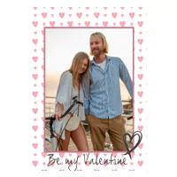 Valentine's Day themed greeting card featuring a couple smiling and embracing. The card has a pink heart border and the text "Be my Valentine" with a heart illustration at the bottom. Ideal for personalised gifts in South Africa and Valentine's Day gift ideas.