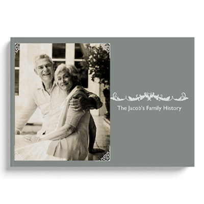 Elegant hardcover photo book titled 'The Jacob's Family History' featuring a grey cover with a vintage-style black and white photo of an elderly couple. Ideal for preserving family memories, this photobook makes a thoughtful gift for special occasions such as Christmas, birthdays, or anniversaries.