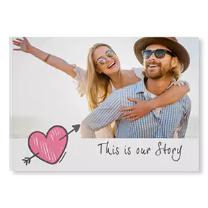 Hardcover photo book with a 'Love' theme, featuring a couple on the cover with a pink heart and arrow graphic. The text 'This is our Story' is written below the image. Ideal for personalised gifts, Valentine's Day, anniversaries, or special occasions. Perfect for creating a memorable photo album.