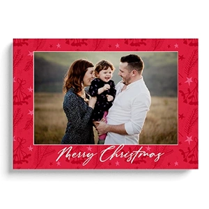 Hardcover Christmas-themed photo book with a vibrant red cover featuring festive patterns and the text 'Merry Christmas' in elegant white script. Ideal for personalised gifts, photo albums, and capturing holiday memories. Perfect for Christmas gift ideas and photo keepsakes.