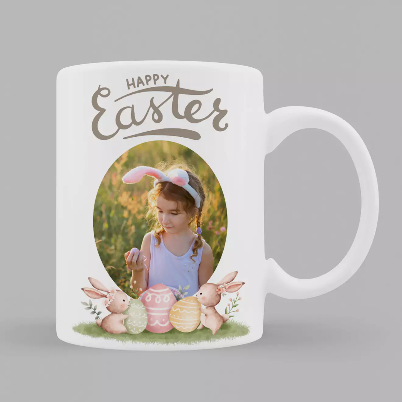 White ceramic mug with an Easter theme, featuring a "Happy Easter" message at the top. The design includes a photo of a young girl wearing bunny ears, surrounded by pastel-coloured Easter eggs and cute bunny illustrations. Ideal for personalised gifts in South Africa.