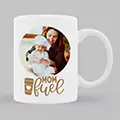 White ceramic mug featuring a personalised design with a photo of a mother and baby, accompanied by the text "Mom Fuel" in stylish lettering. Ideal for Mother's Day, baby shower gift ideas, or personalised gifts in South Africa.