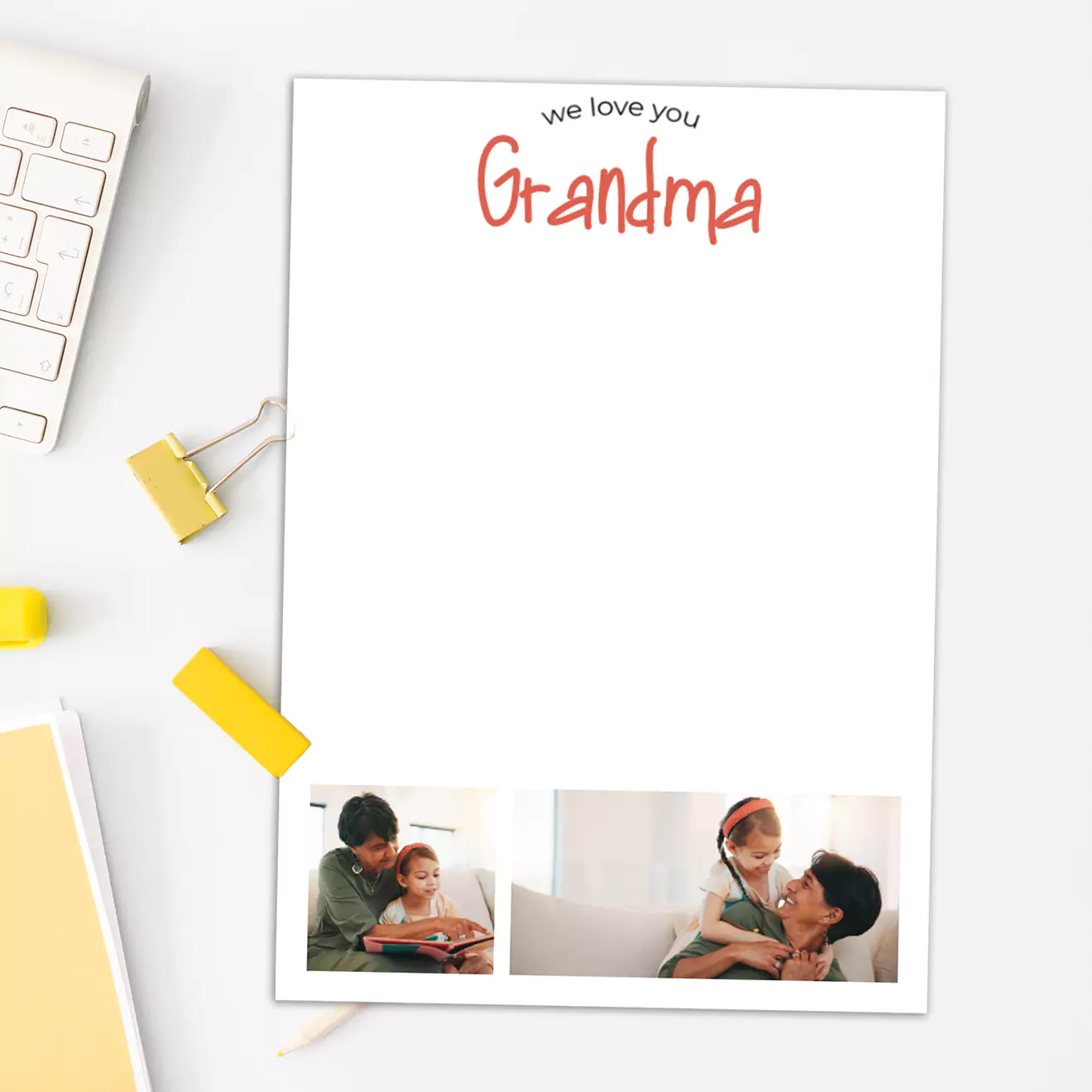 Personalised notepad with "We love you Grandma" written at the top in red text. The notepad features two small photos of family moments at the bottom. Ideal as a thoughtful gift for grandparents, perfect for jotting down notes or messages. Suitable for various occasions including Christmas and birthdays.