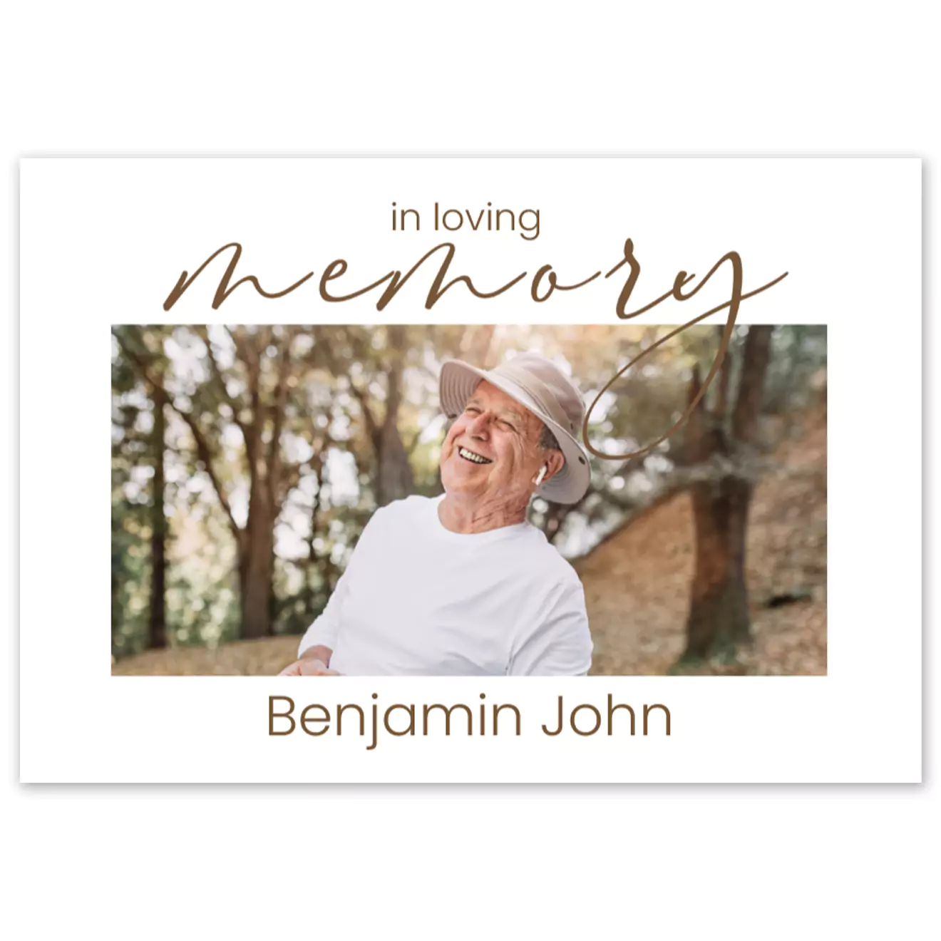 Hardcover memory book with a white cover featuring a photo of an elderly man smiling outdoors. The text 'in loving memory' is written in elegant gold script above the photo, with the name 'Benjamin John' below. Ideal for personalised gifts, photo albums, and memorial keepsakes.