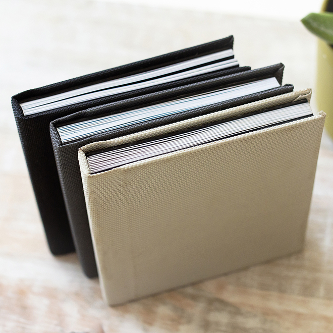 Rapidstudio small bragbook photobook with black or cream linen cover and layflat pages