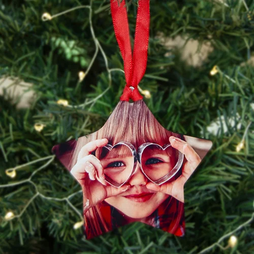 Image of personalised Christmas tree decorations from RapidStudio, adorned with custom photos to add a unique and festive touch to holiday decor.