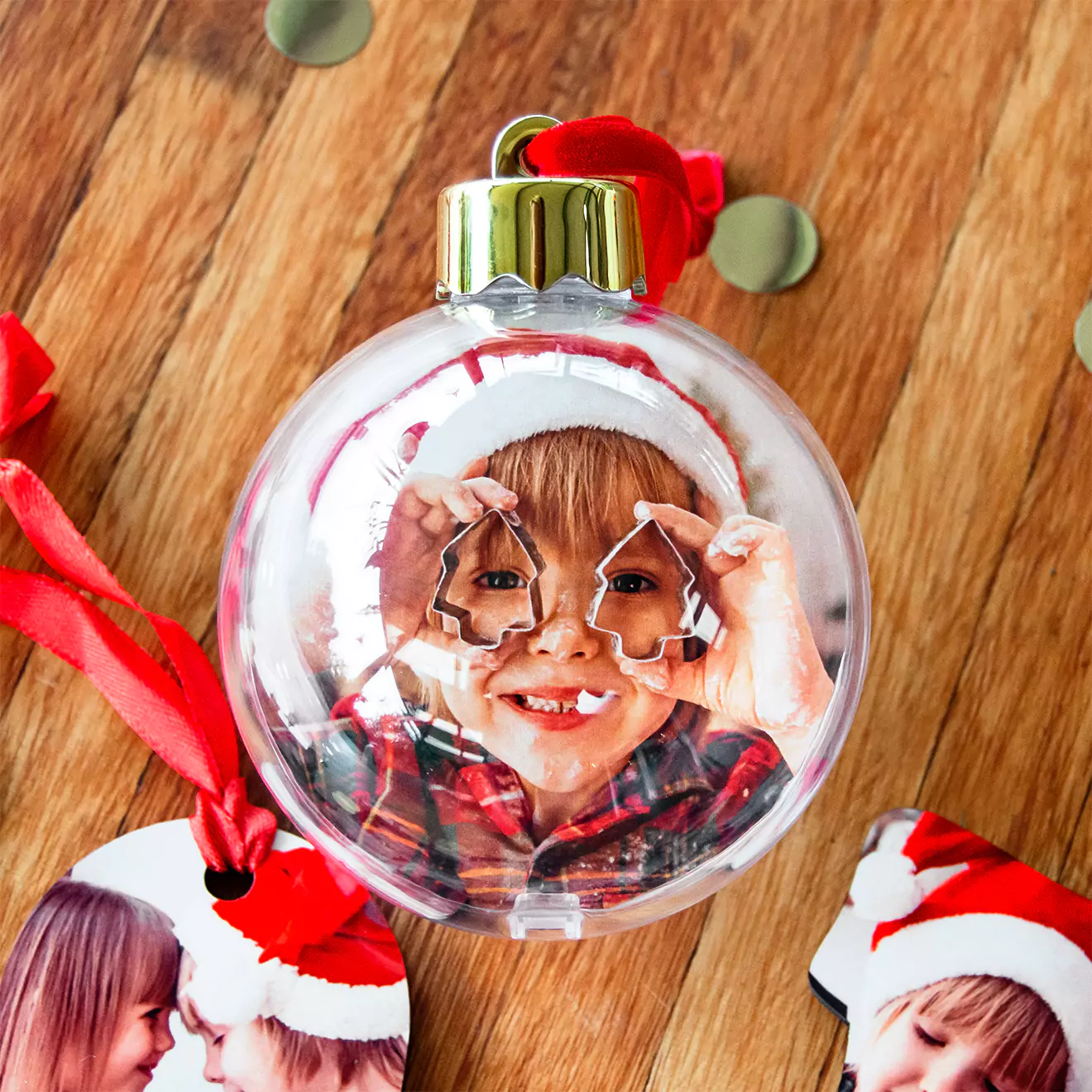 Image of personalised photo baubles from RapidStudio, featuring custom images to bring cherished memories to your festive decorations.