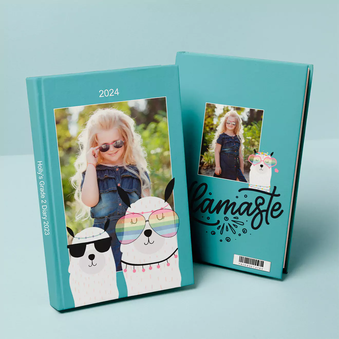 Turquoise 2024 diary featuring a personalised cover with a photo of a young girl and playful llama illustrations. The back cover displays another photo of the girl with the word "Namaste" and a small llama graphic. Ideal for gifts for her, Christmas gifts, or personalised gifts in South Africa.