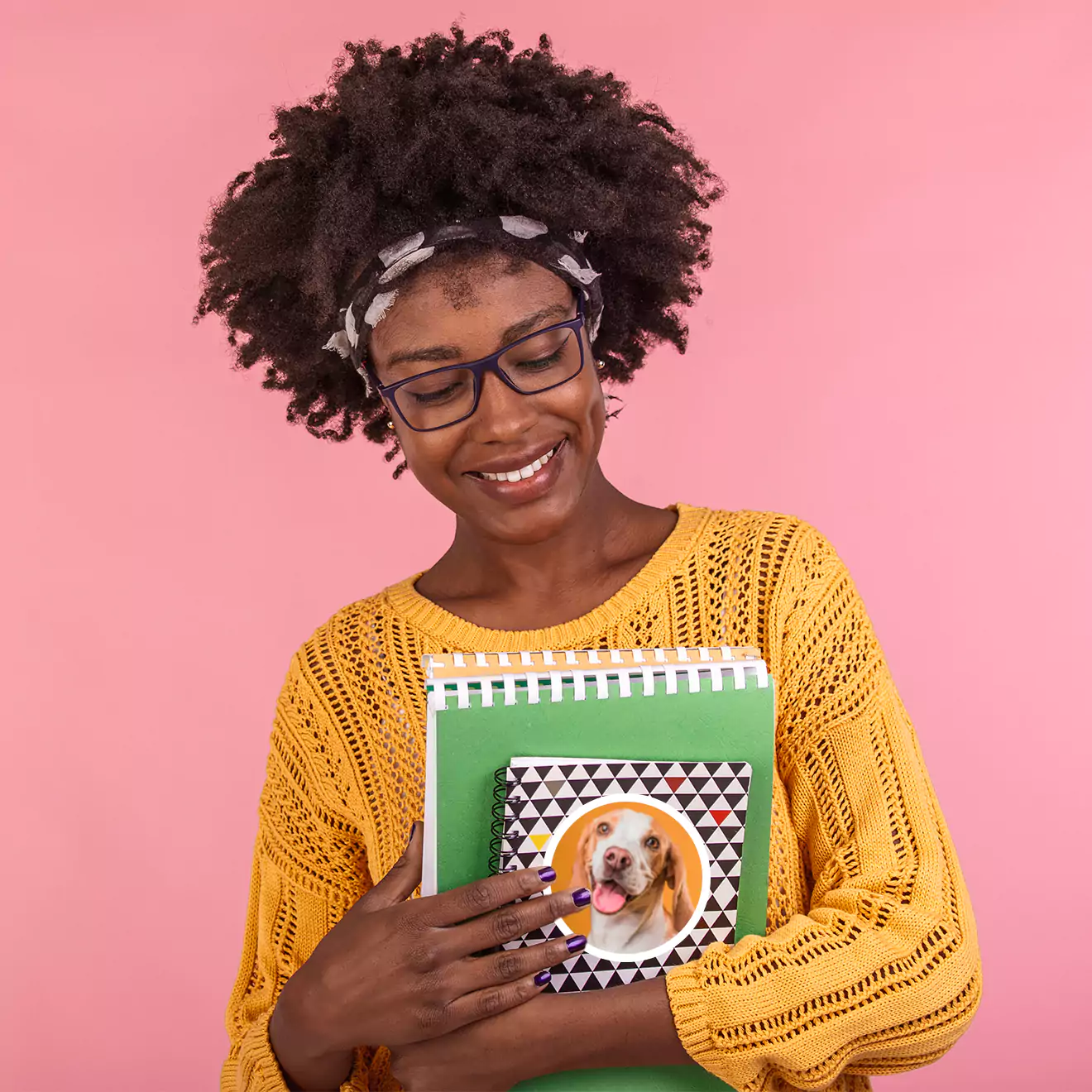 Teacher looking adoringly at her personalised books with custom designs, showing her appreciation for the unique and thoughtful gifts.