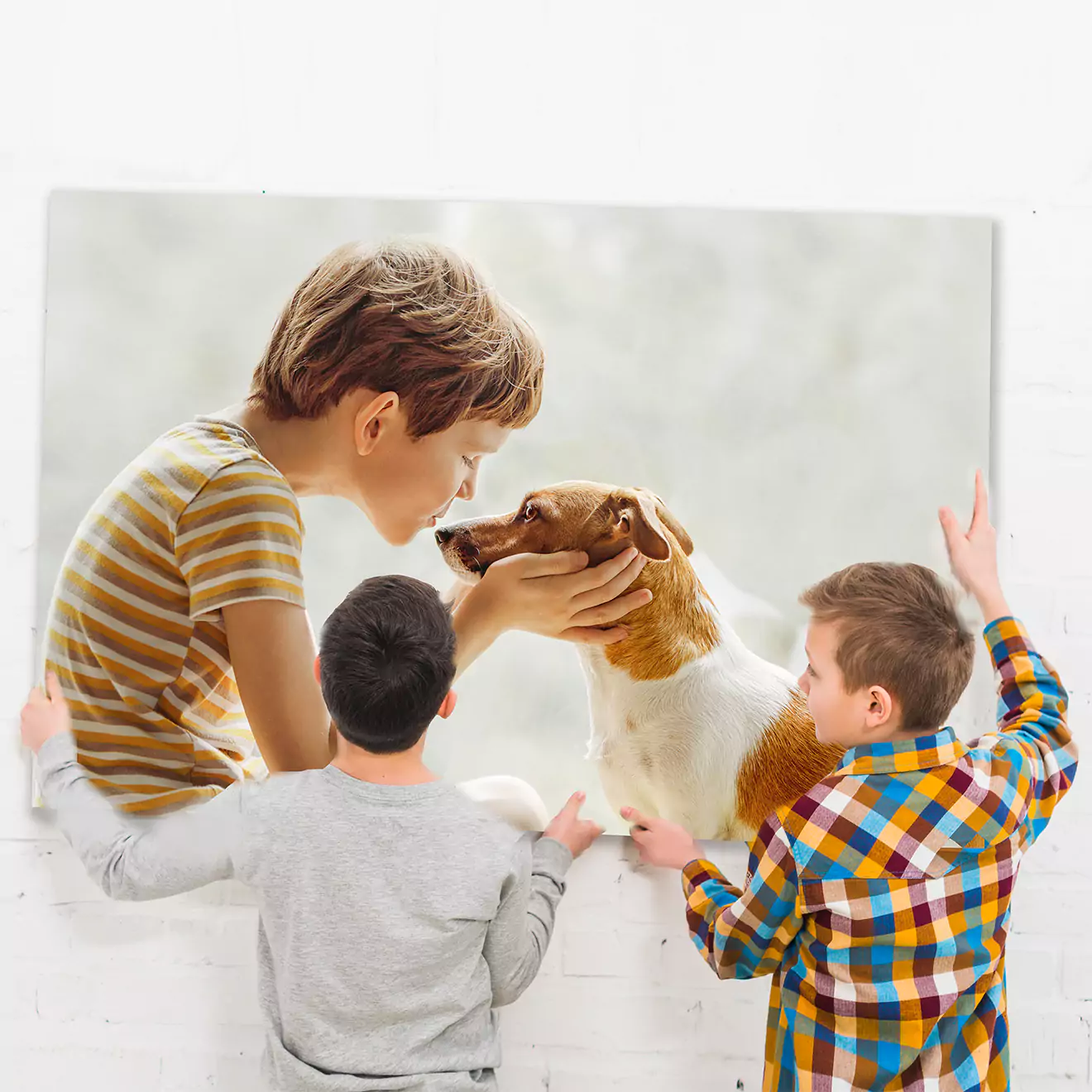 Large canvas print featuring a touching moment between a young boy and his dog, being admired by two children. Ideal for memorialising beloved pets, this personalised photo canvas makes a heartfelt gift.