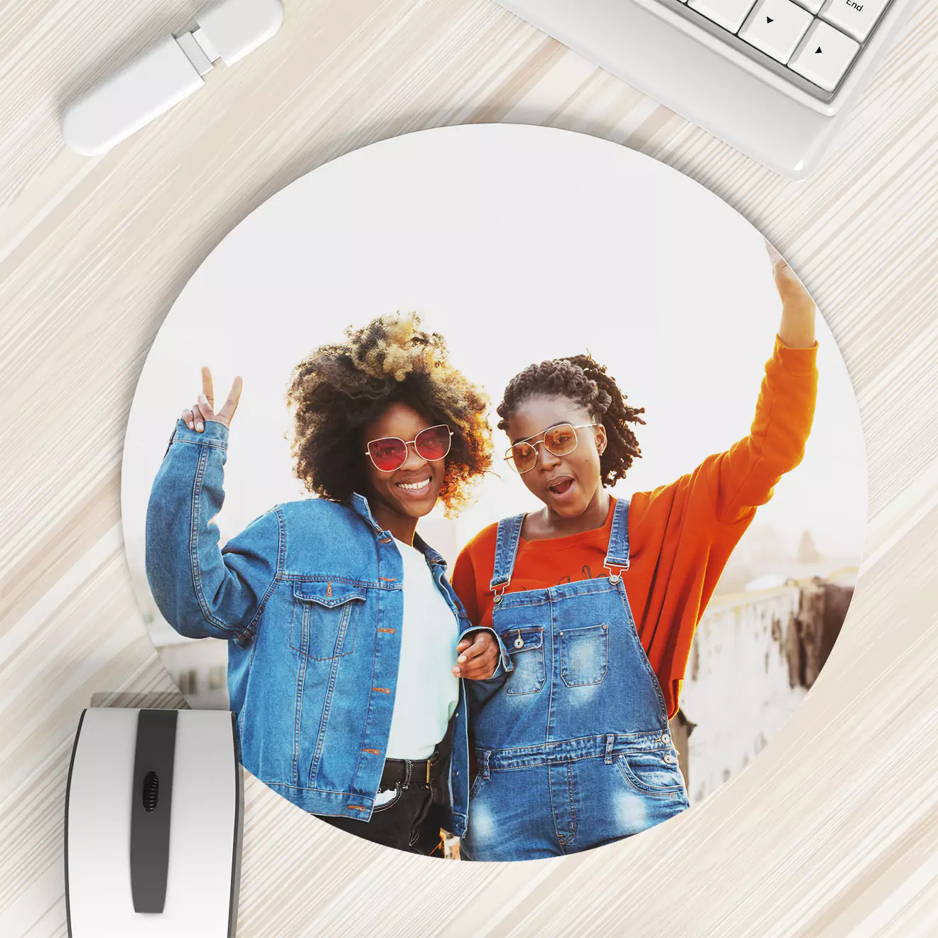 Round personalised mouse pad featuring a vibrant photo of two smiling women, one in a denim jacket and the other in denim overalls, posing joyfully. Ideal for adding a personal touch to your workspace or as a thoughtful gift. Perfect for Christmas, birthdays, or other special occasions.