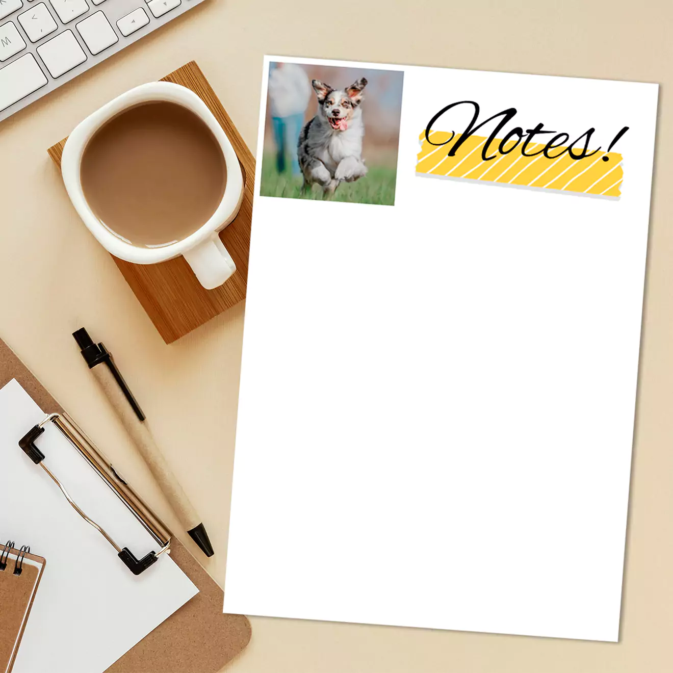 "Personalised notepad featuring a photo of a dog and the word 'Notes!' in stylish black font with a yellow accent. The notepad is placed on a beige desk alongside a cup of coffee, a pen, a clipboard, and a keyboard. Ideal for gifts for men, Christmas gift ideas, and personalised gifts in South Africa."