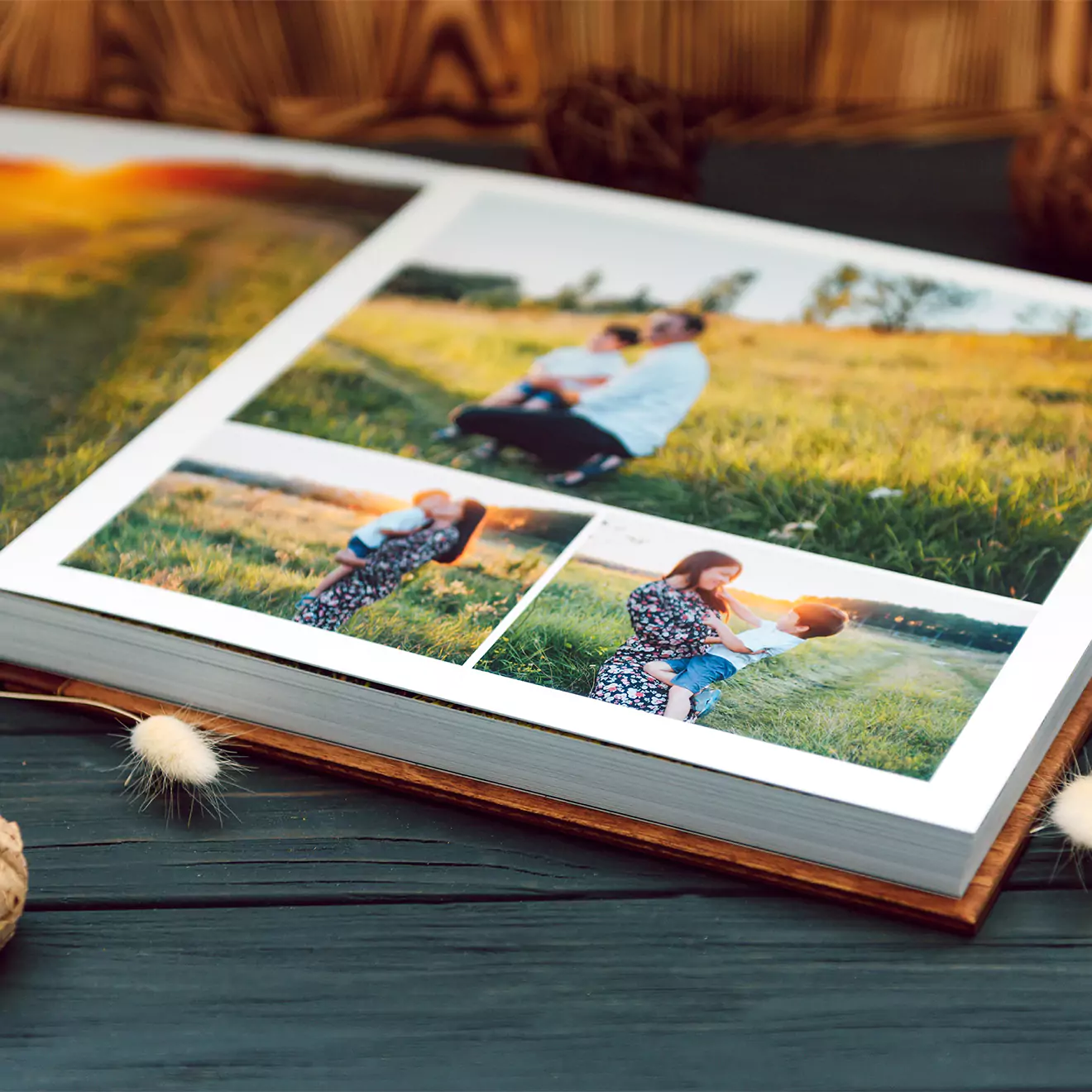 Open photo book displaying three images of a mother and child in a grassy field. The book has a hardcover with a rustic wooden background. Ideal for personalised gifts, photo albums, and special occasions such as baby showers, Christmas, or Valentine's Day.