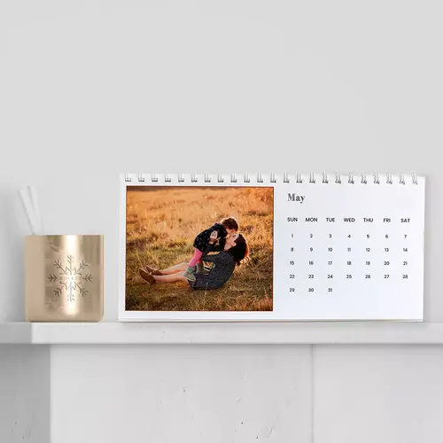 Large-sized personalised desk calendar, providing ample space for daily notes and appointments, alongside beautifully printed photos for each month, making it a standout addition to any desk setup.