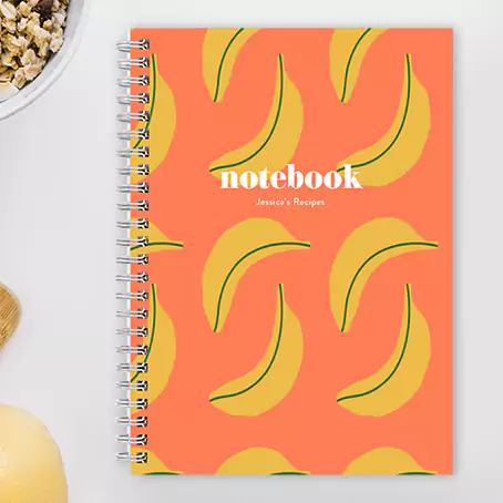 Banana-themed personalised A4 soft cover notebook, featuring a fun and fruity banana design. Ideal for jotting down thoughts, recipes, or daily tasks, adding a playful touch to your stationery collection. Great gift for teens