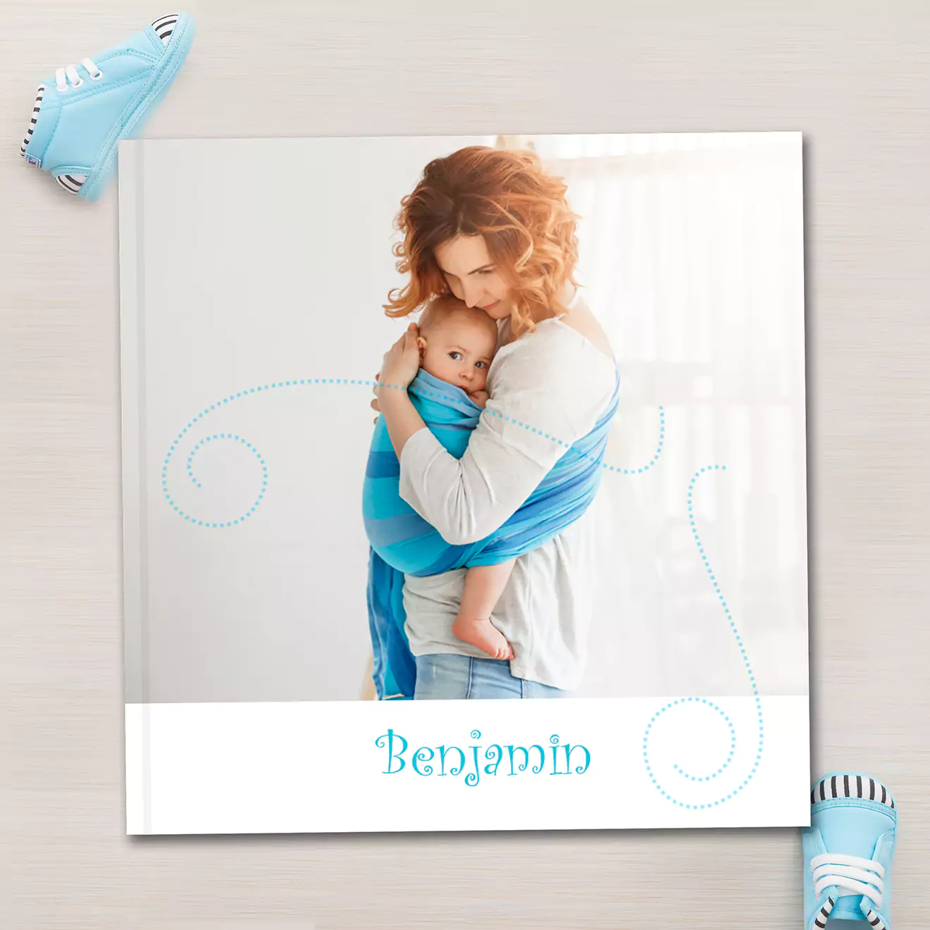 Blue baby personalised hardcover 30cm photobook, celebrating the whimsical moments and milestones of babyhood with playful designs, perfect for cherishing those adventures.