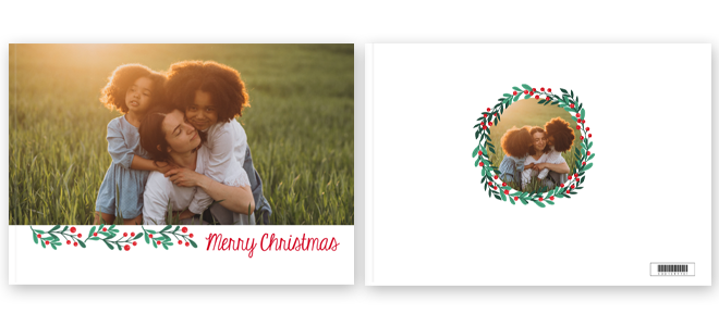 Christmas-themed photobook cover featuring a family photo with a ''Merry Christmas'' message in red script. The front cover displays a full-size image of a family in a field, while the back cover has a smaller circular photo framed with festive holly and berry decorations. Ideal for personalised Christmas gifts.