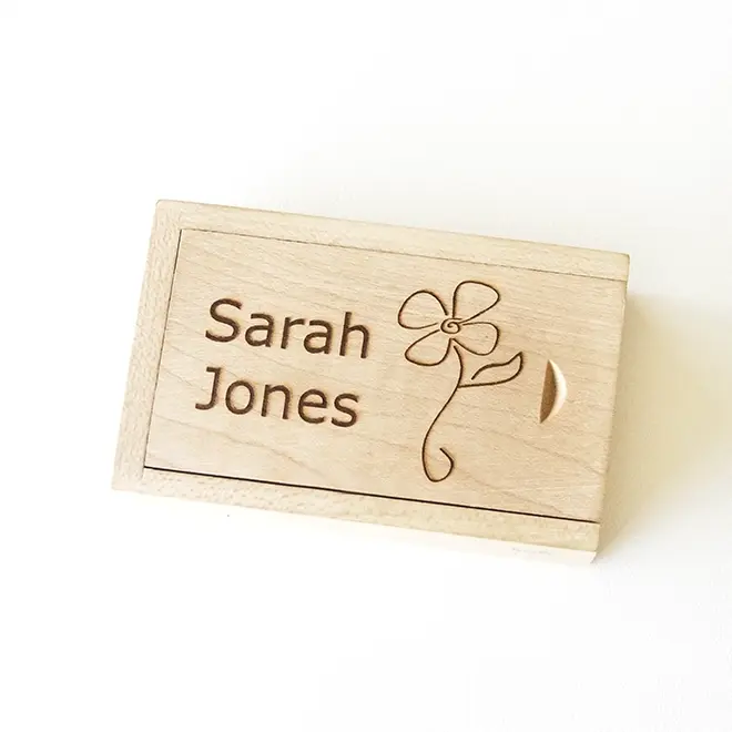 Personalised wooden USB drive with a sliding cover, engraved with a name and a simple flower design. Ideal for storing digital photo albums, making it a thoughtful gift for occasions like birthdays, Christmas, or Valentine's Day. Suitable as a gift for men, women, or as a baby shower gift.