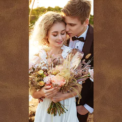 A romantic couple embraces outdoors, with the woman holding a bouquet of flowers. The image is framed by a brown leather-like border, suggesting a photobook or album cover design.