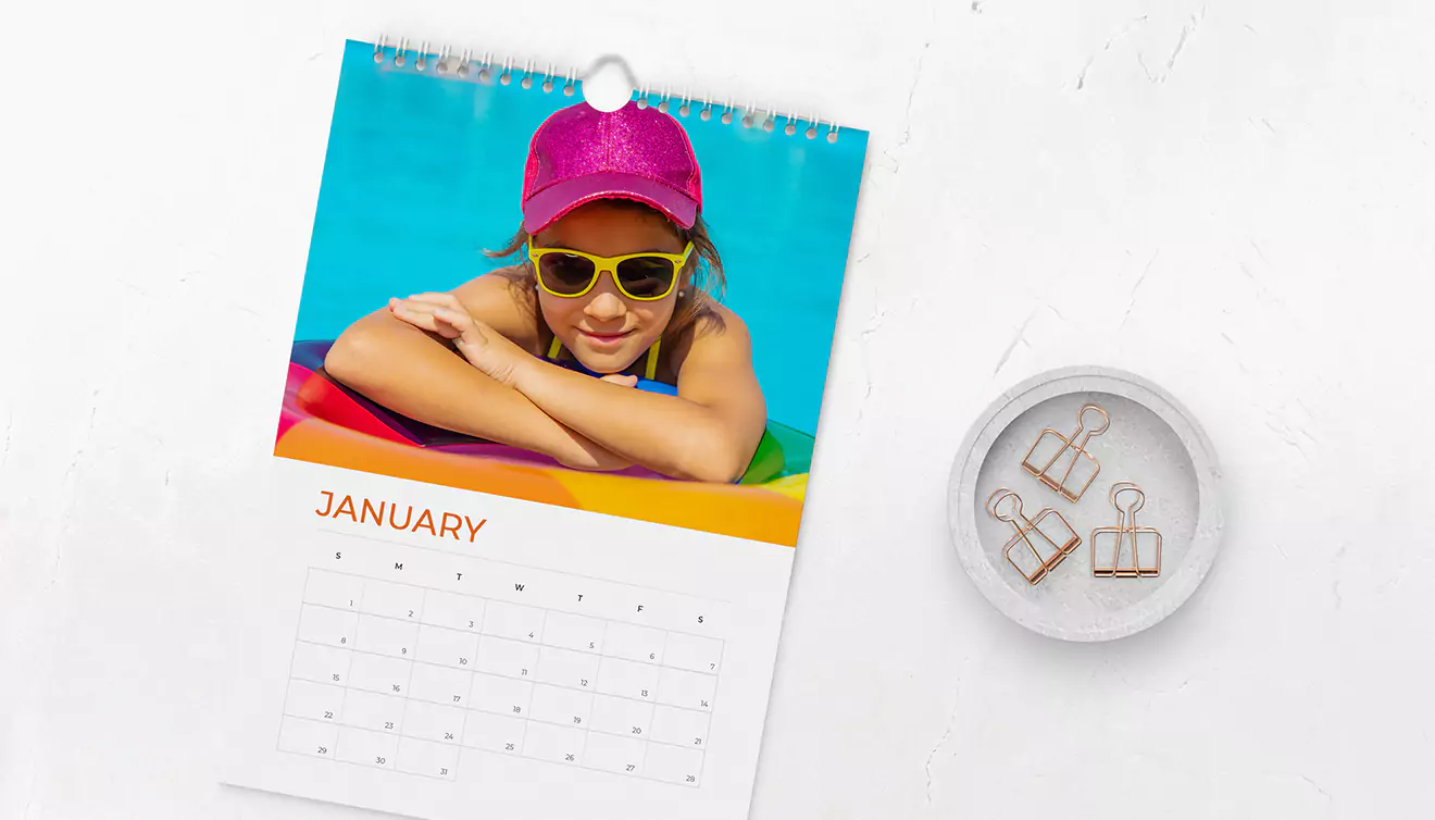 Photo Wall calendar featuring a photo of a child swimming in a pool - banner