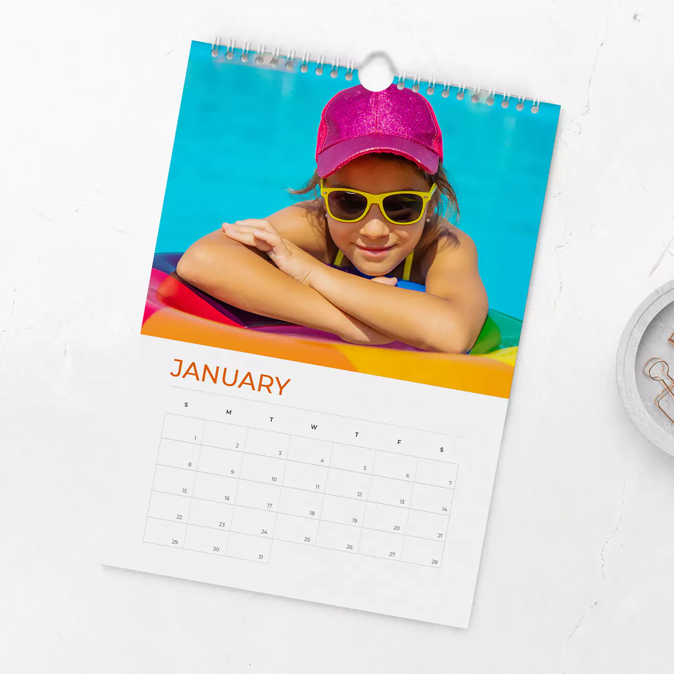 Photo Wall calendar featuring a photo of a child swimming in a pool