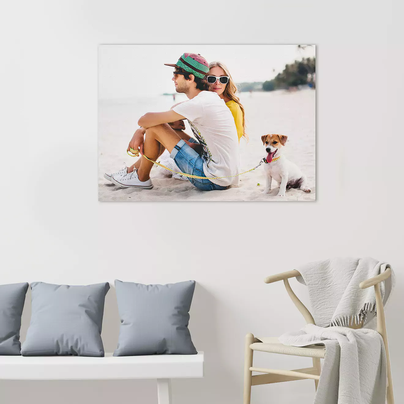 Canvas on the wall featuring a young couple with their dog, capturing a loving family moment