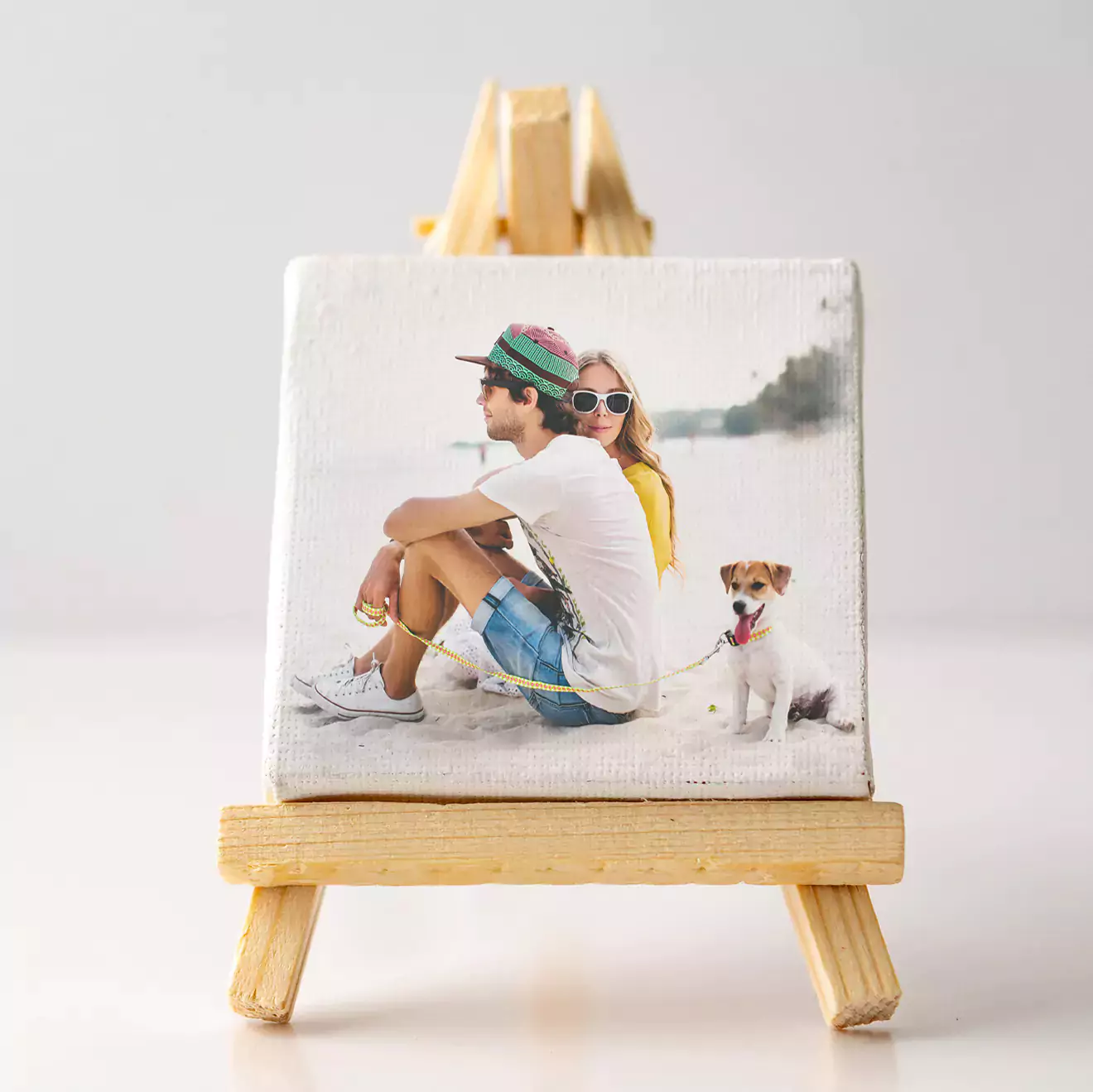 Mini-canvas called an Instablock, featuring a young couple on the canvas, displayed on an easel