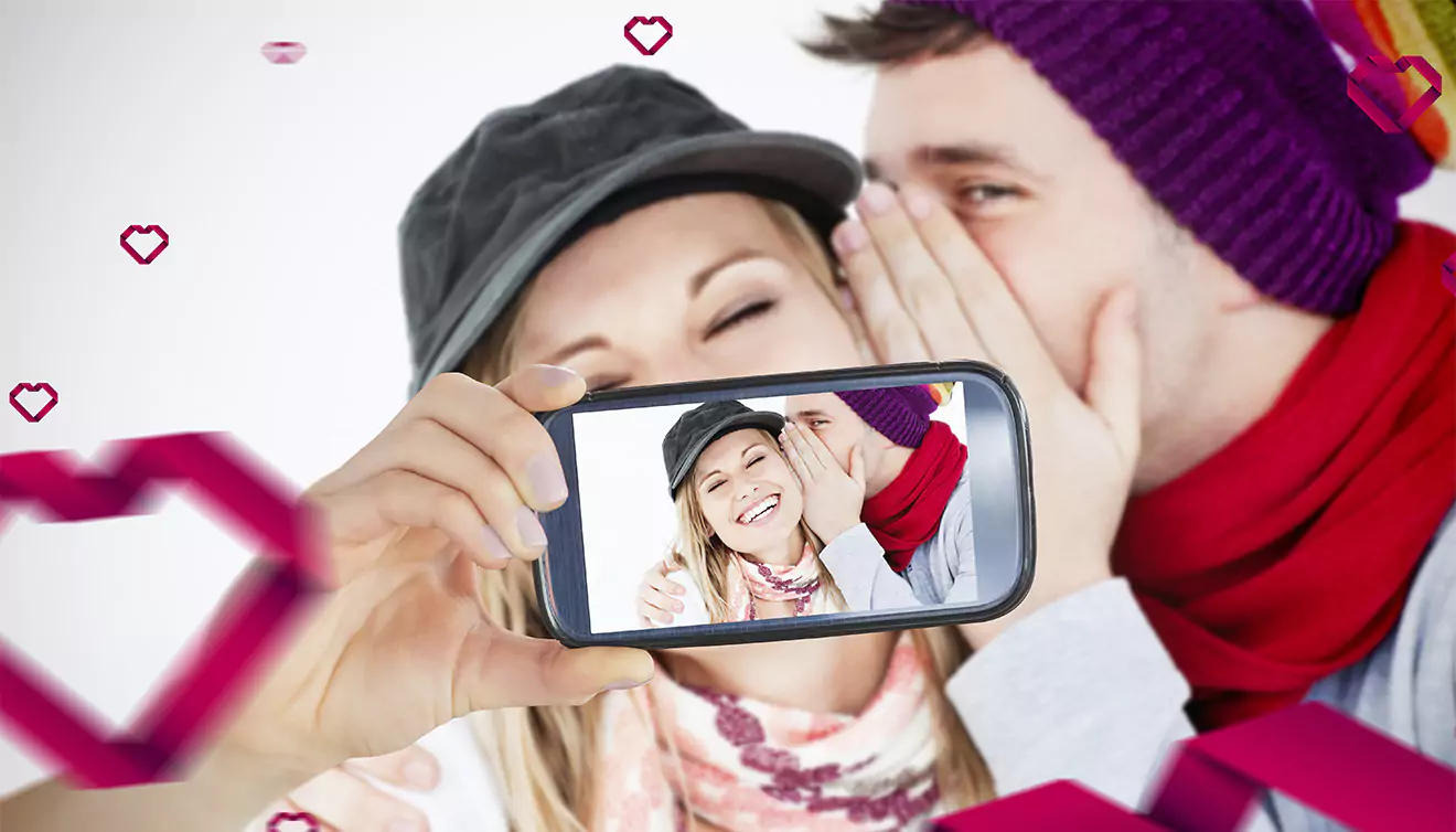 Couple taking a selfie together, capturing a fun and intimate moment - banner