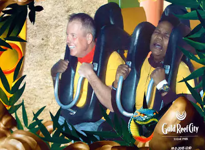 Close-up of a RapidStudio team member with a look of terror on their face while riding a roller coaster at Gold Reef City