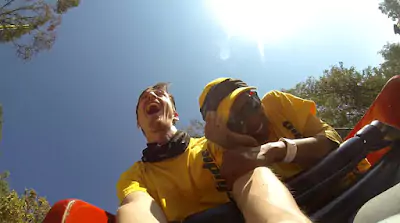 Close-up of the two of the RapidStudio team on a roller coaster at Gold Reef City during their team-building event, capturing their excitement